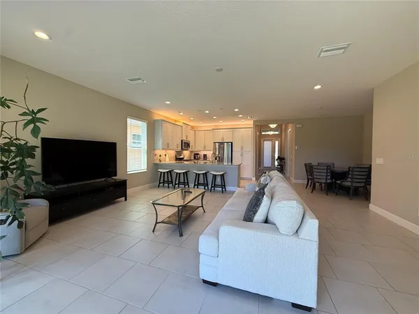 a living room with furniture and a table