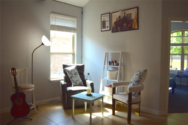 a living room with furniture and a window