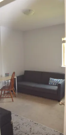 a living room with a couch and a table