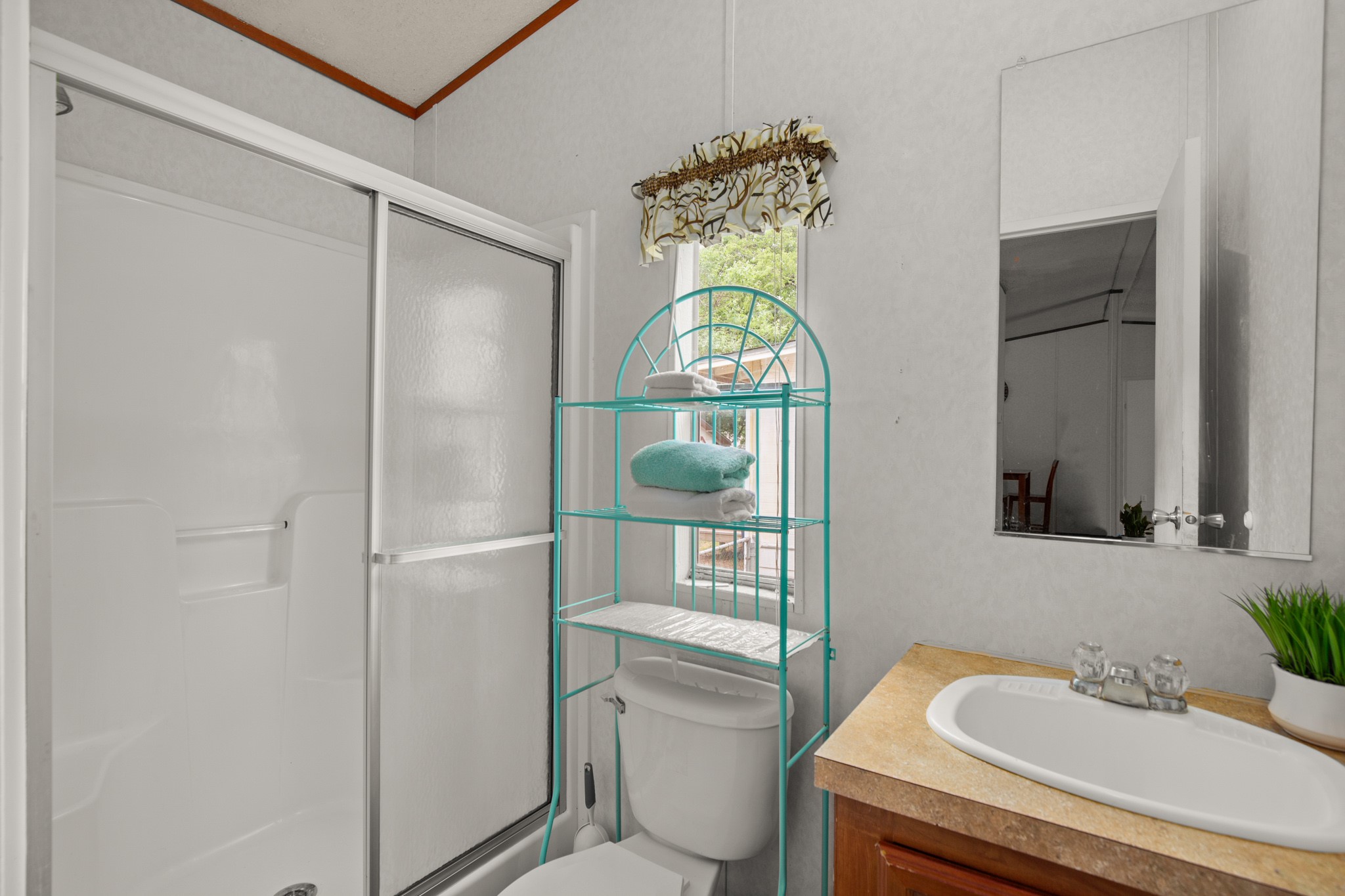 1104 Vasquez Street Austin, TX 78741 - Photo 14 of 18 a bathroom with a sink toilet and shower