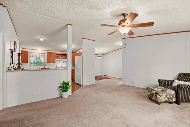 a very nice looking room with a ceiling fan