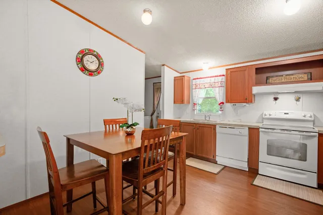 a kitchen with a table and chairs in it