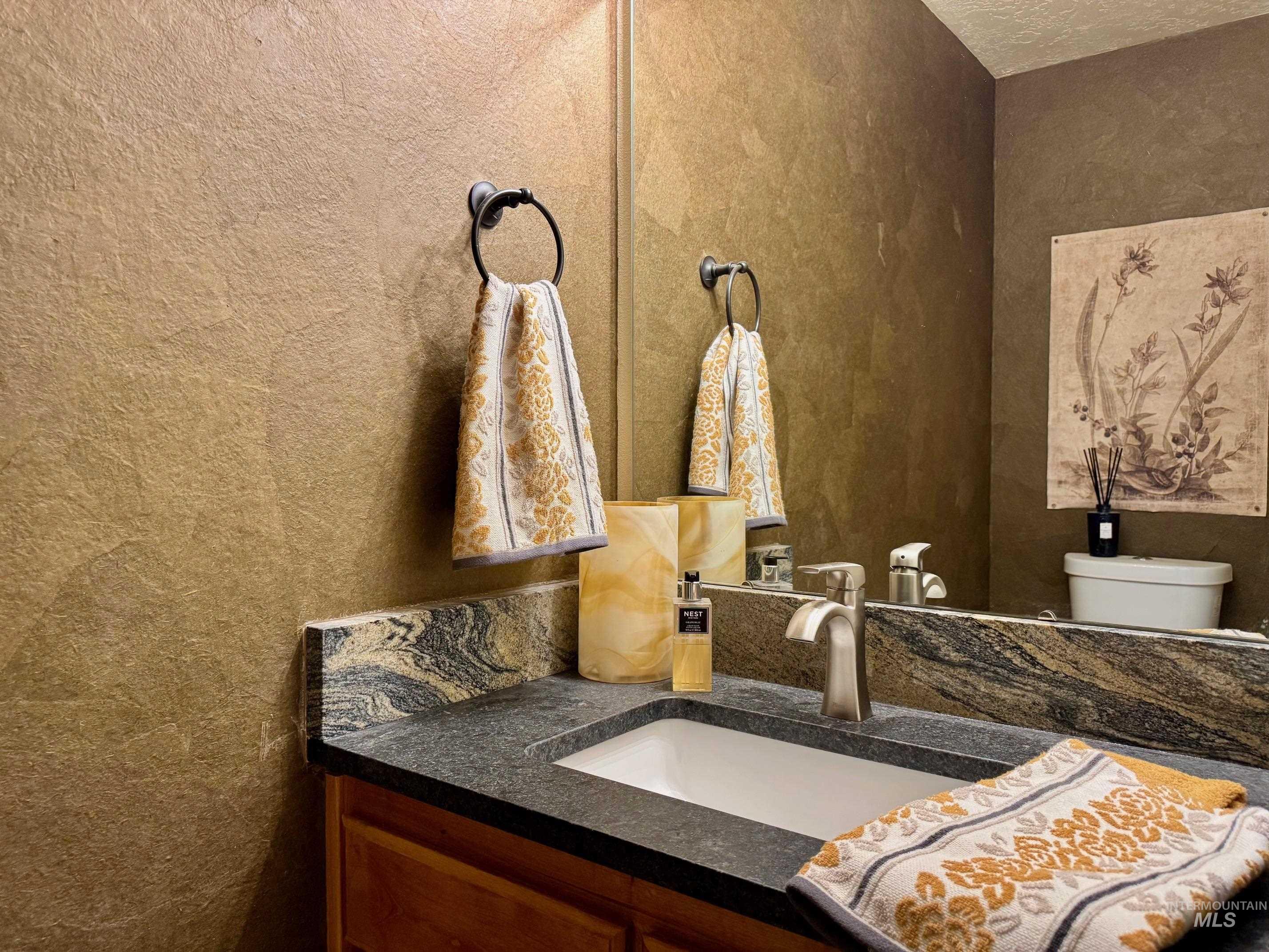 9299 Kemp Road Middleton, ID 83644 - Photo 39 of 50 Vanity with dark countertop, undermount sink, and single-handle faucet