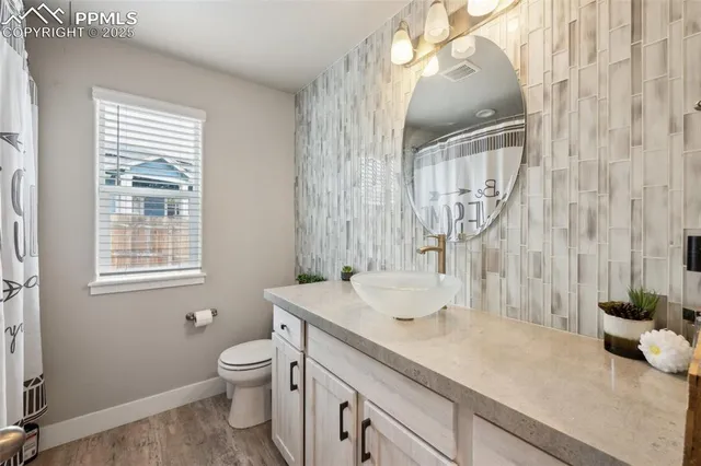 a bedroom with furniture and a baby crib