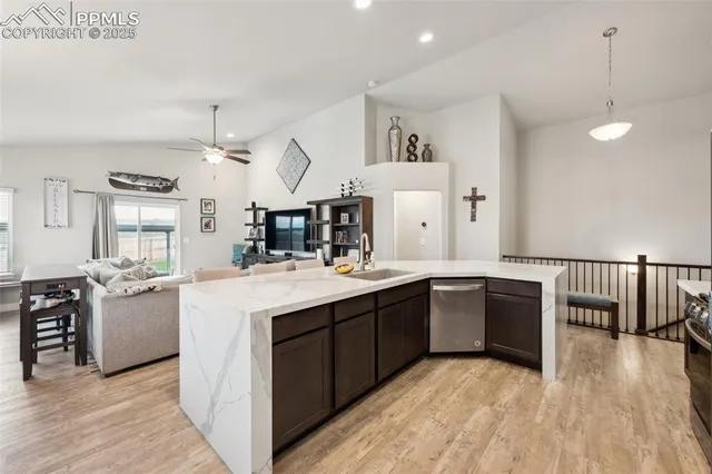 a kitchen with stainless steel appliances granite countertop a sink and stove