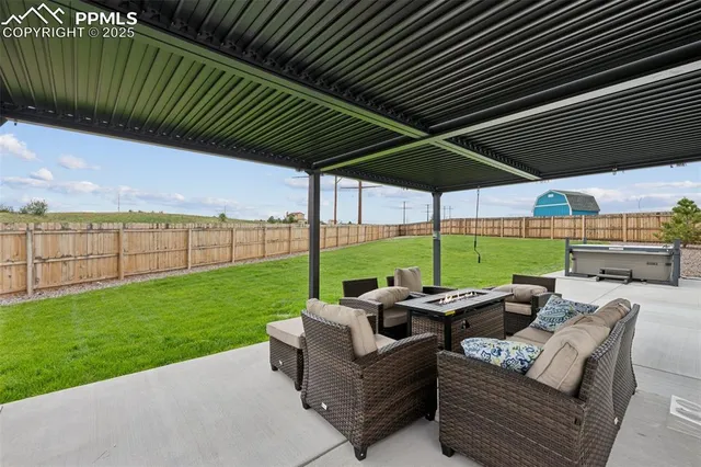 an aerial view of a house with a garden and deck