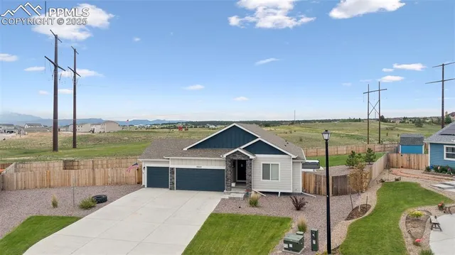a view of a terrace with a table and chairs
