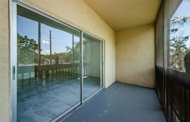 a view of a glass door with a balcony
