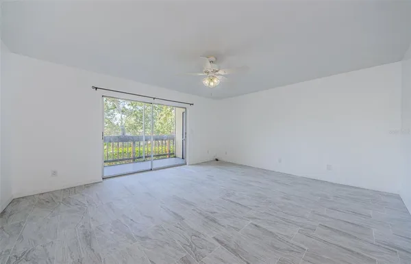 a view of an empty room with a window