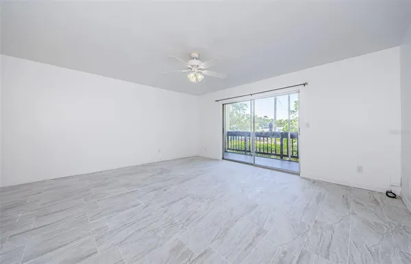 a view of an empty room with a window