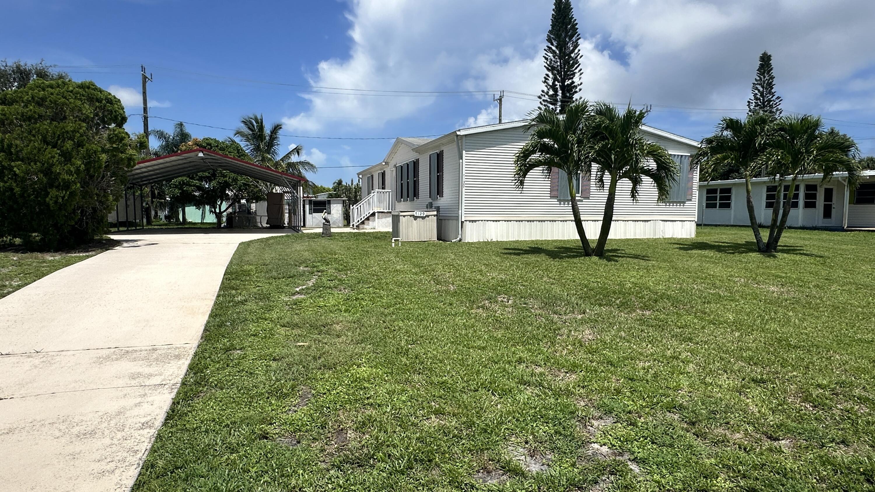 7129 Southeast Ridgeway Terrace Hobe Sound, FL 33455 - Photo 1 of 35 EXTERIOR FRONT