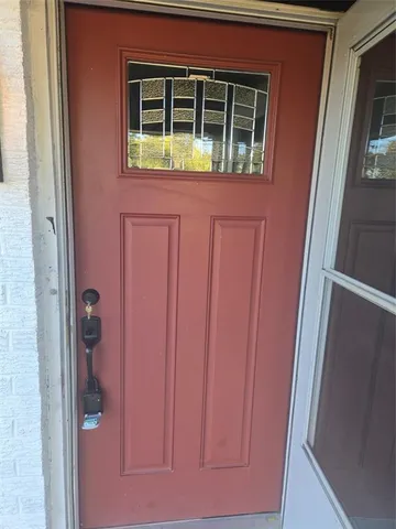 a view of a livingroom with a workspace wooden floor and window