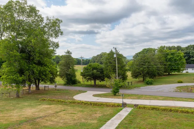 a view of an empty room with fire place