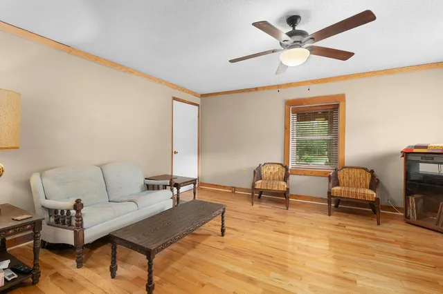 a bathroom with a toilet a sink and a window