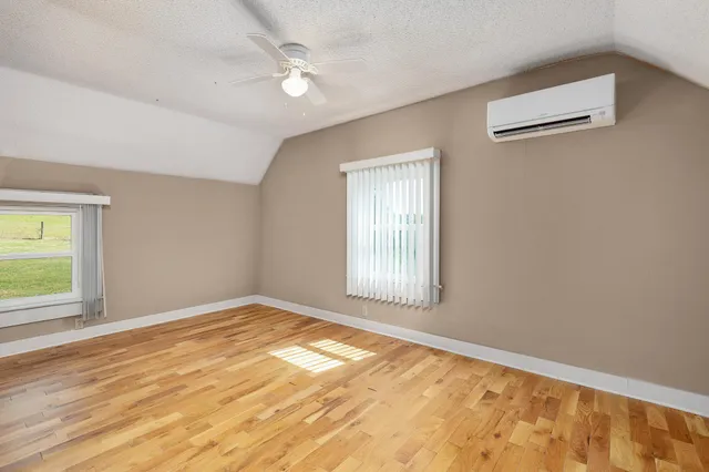 a balcony with wooden floor and fence