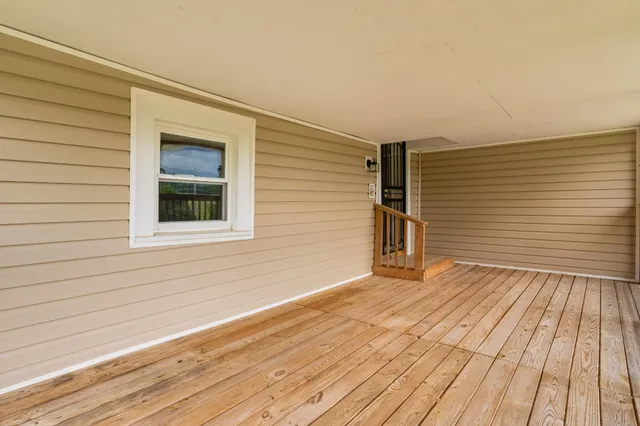 a view of a swimming pool with a yard