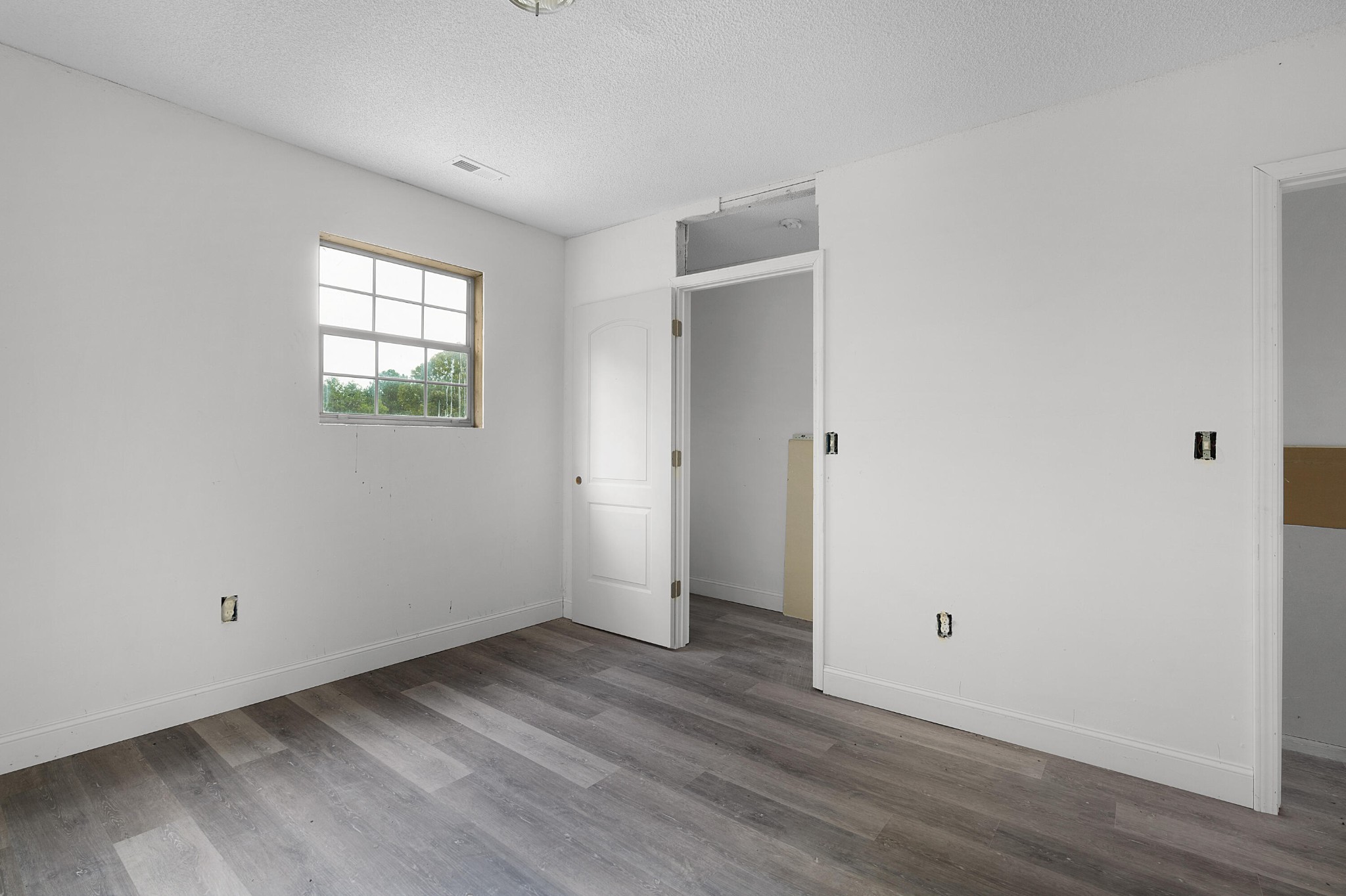 930 Kensington Road Chickamauga, GA 30707 - Photo 63 of 82 an empty room with wooden floor and windows