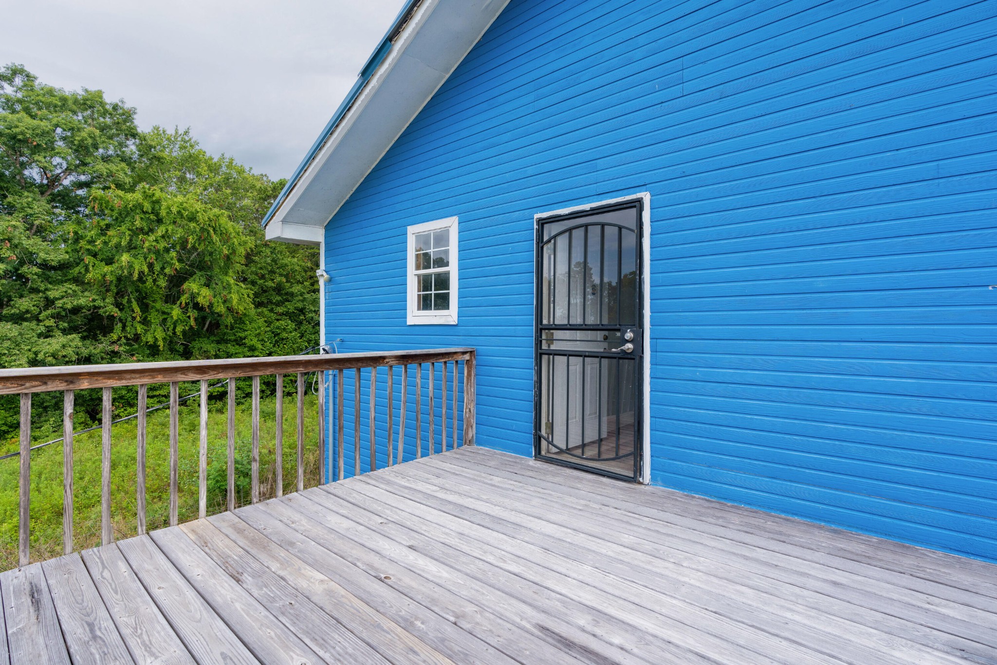 930 Kensington Road Chickamauga, GA 30707 - Photo 64 of 82 a view of backyard with wooden deck and floor to ceiling window