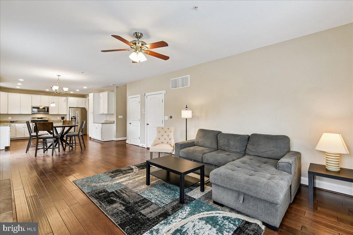 7526 Gilley Terrace Rosedale, MD 21237 - Photo 18 of 43 a living room with furniture and wooden floor