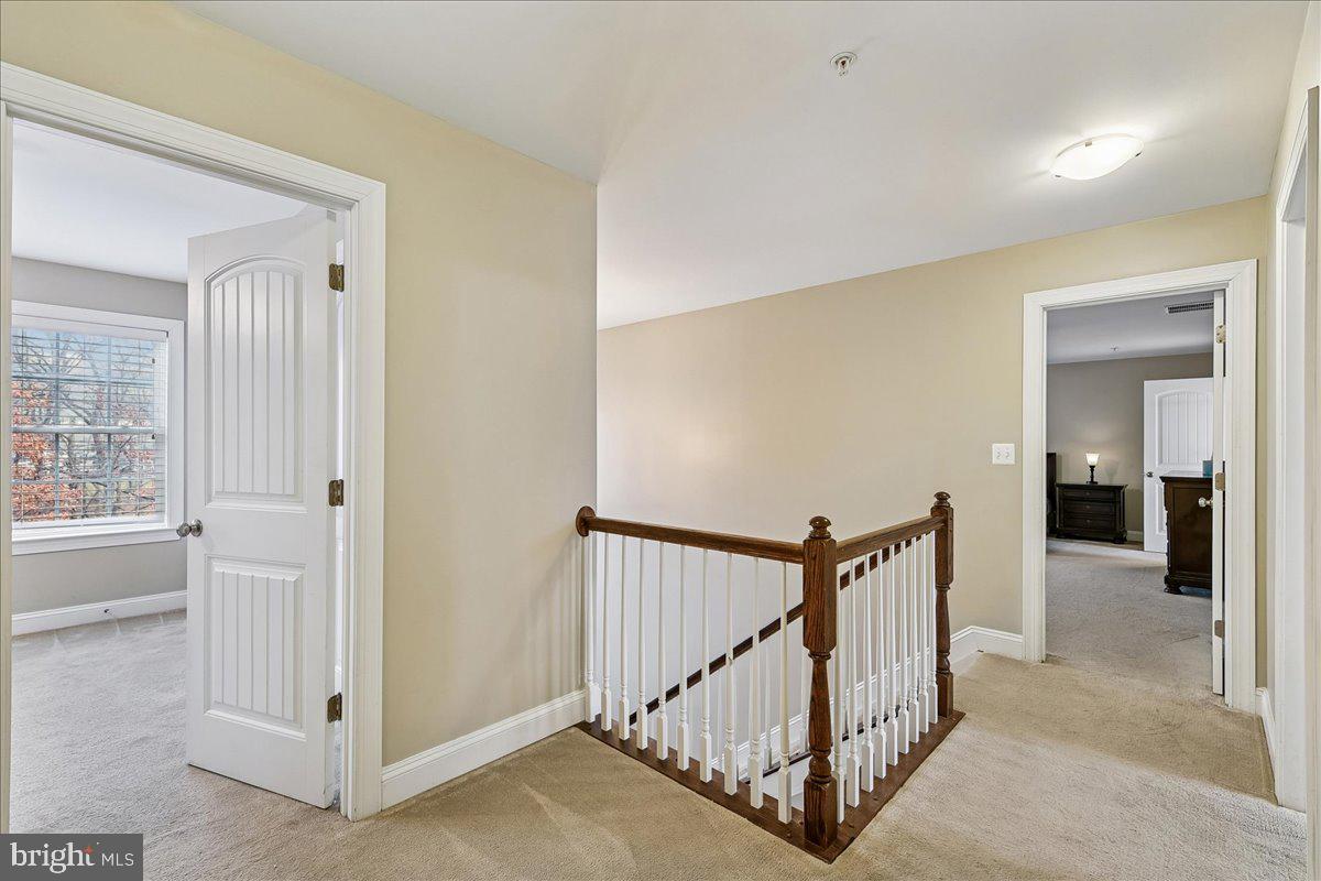 7526 Gilley Terrace Rosedale, MD 21237 - Photo 21 of 43 a view of a hallway with windows and stairs