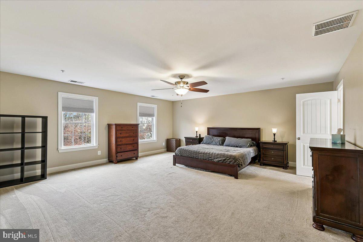 7526 Gilley Terrace Rosedale, MD 21237 - Photo 22 of 43 a living room with furniture and a chandelier