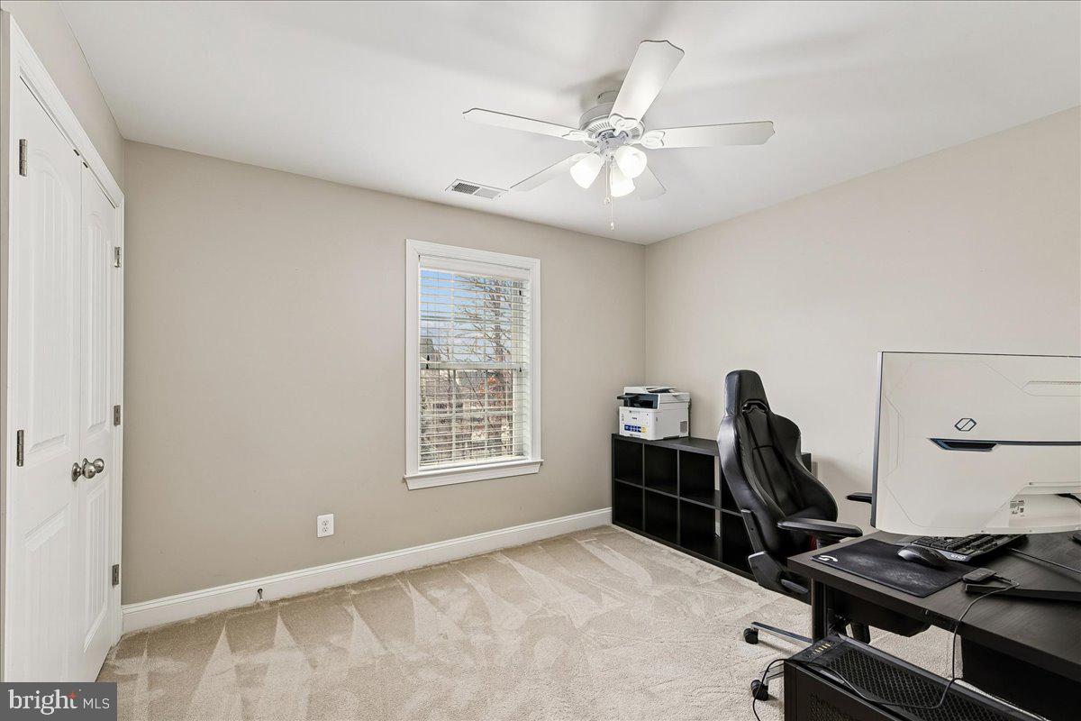 7526 Gilley Terrace Rosedale, MD 21237 - Photo 31 of 43 a view of workspace with wooden floor windows