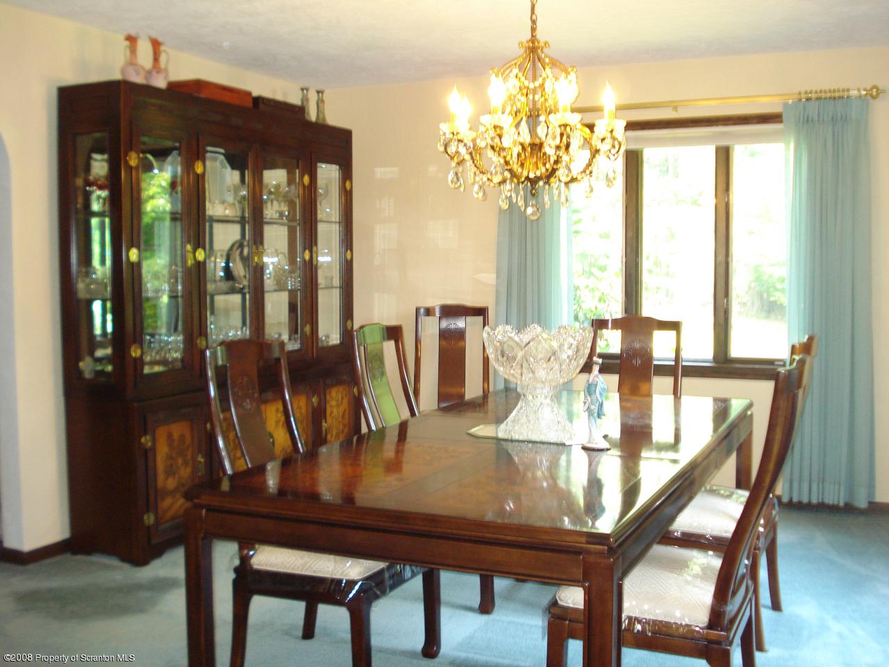 72 Memory Lane Moscow, PA 18444 - Photo 16 of 34 a view of a dining room with furniture window and outside view