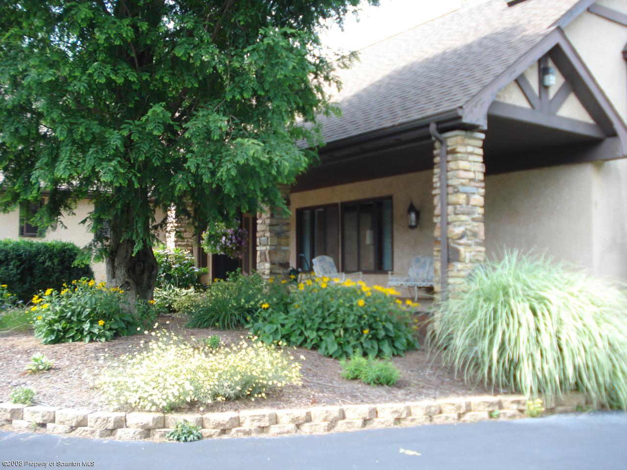 72 Memory Lane Moscow, PA 18444 - Photo 2 of 34 a front view of a house with garden