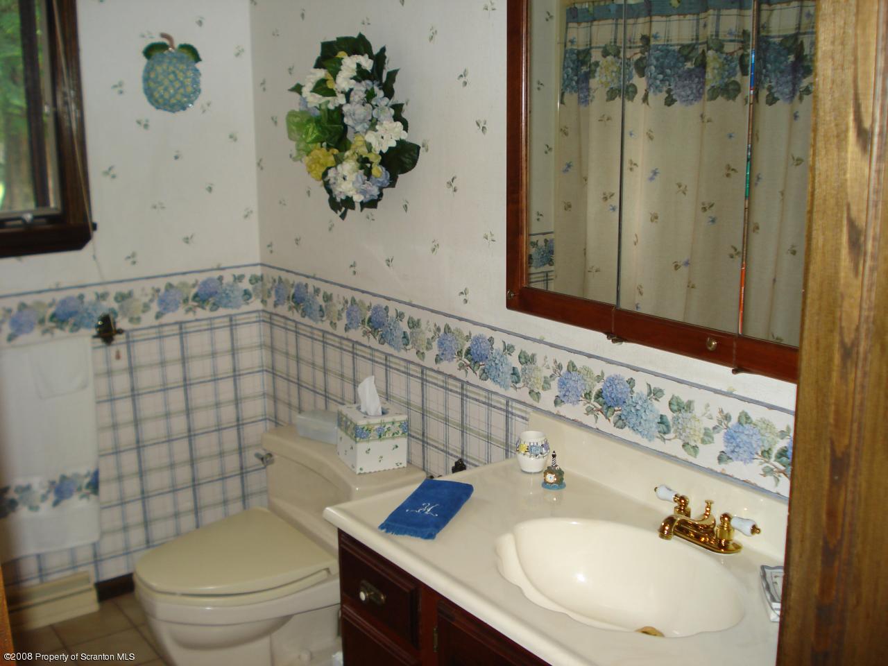 72 Memory Lane Moscow, PA 18444 - Photo 23 of 34 a bathroom with a sink toilet and shower