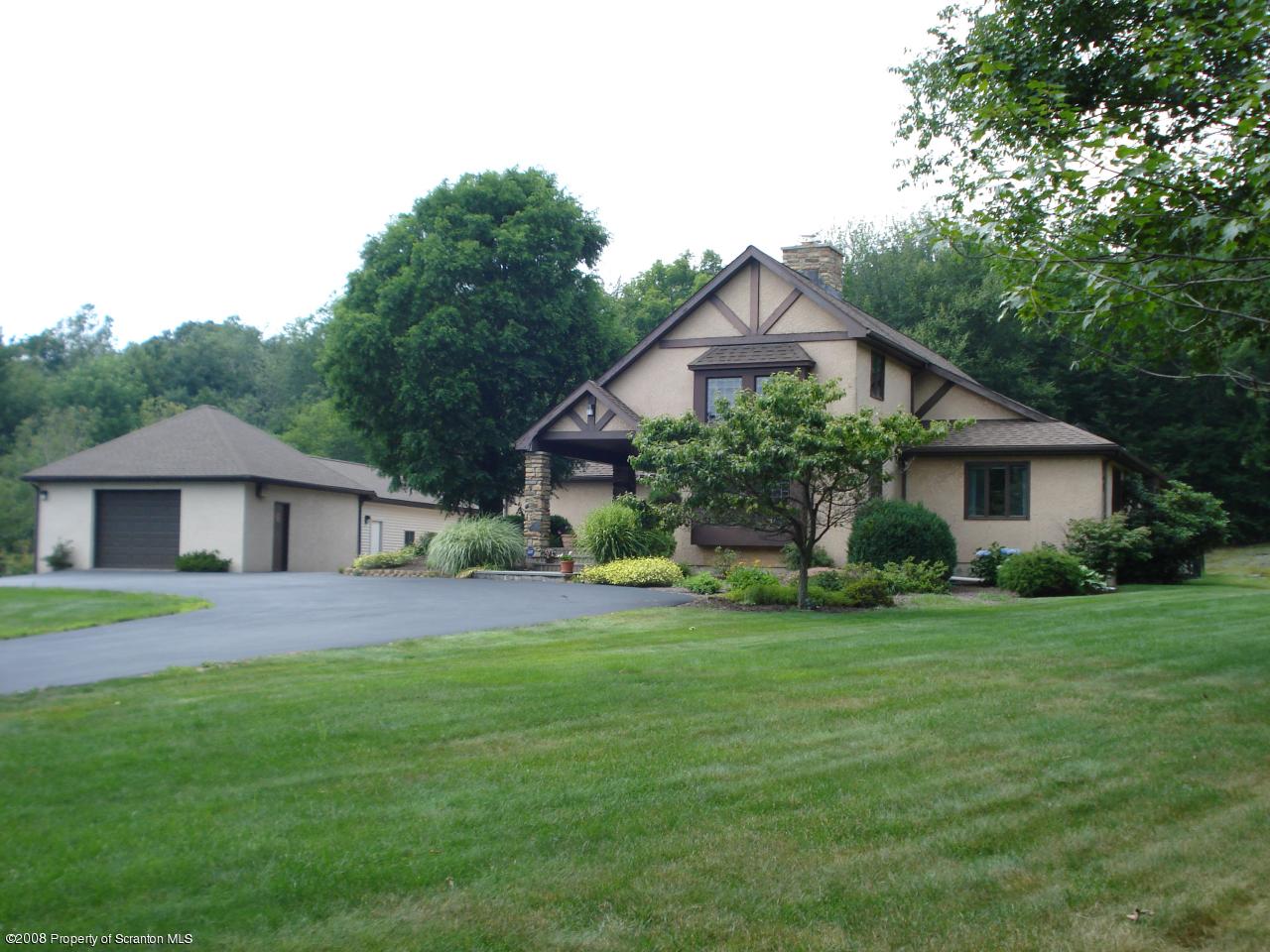 72 Memory Lane Moscow, PA 18444 - Photo 5 of 34 a view of a house with a big yard and large trees