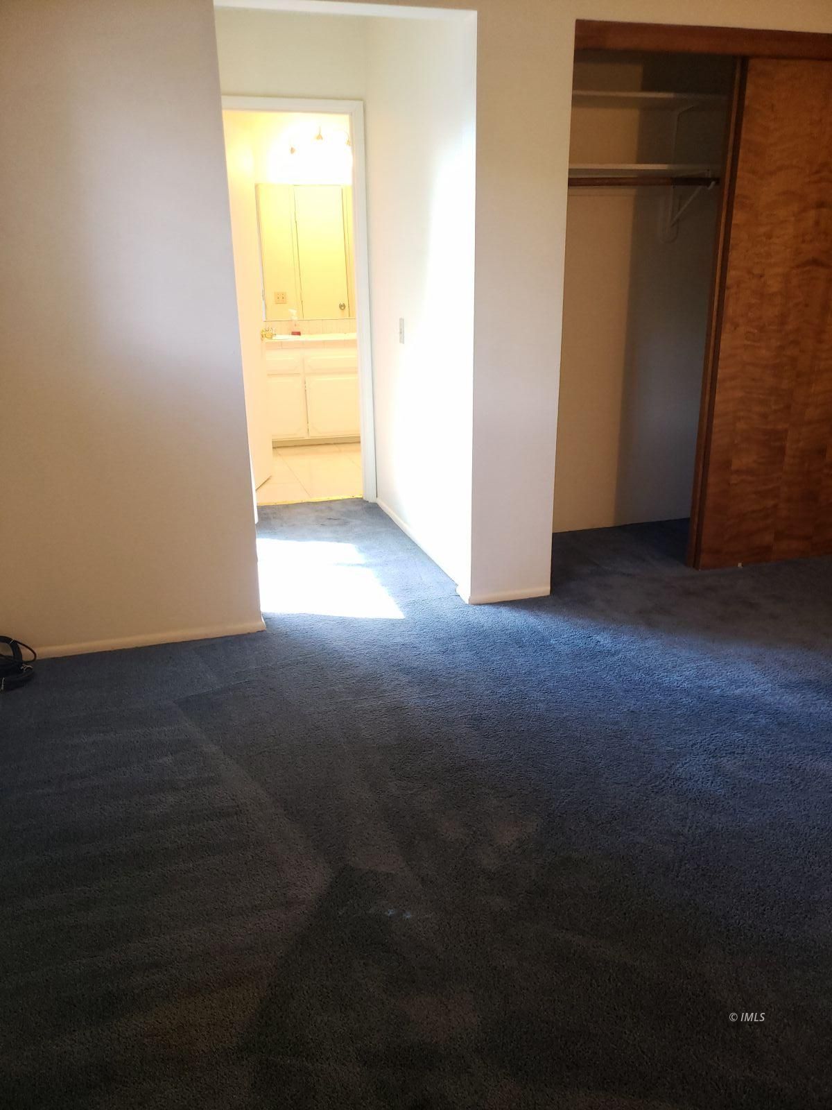 263 East Line Street, Unit F Bishop, CA 93514 - Photo 8 of 13 a view of an empty room with a window