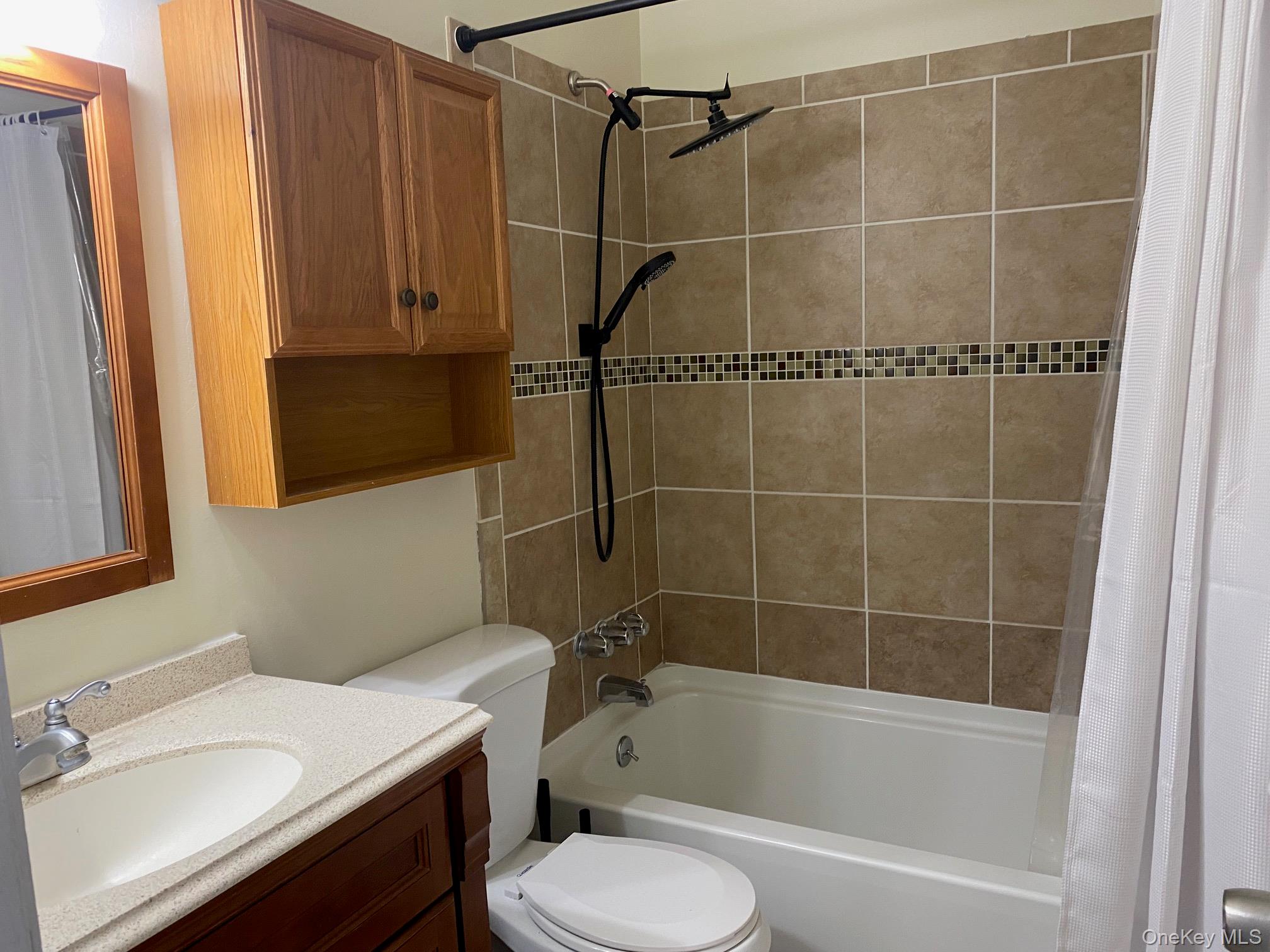276 Temple Hill Road, Unit 2215 New Windsor, NY 12553 - Photo 14 of 16 a bathroom with a sink toilet and shower