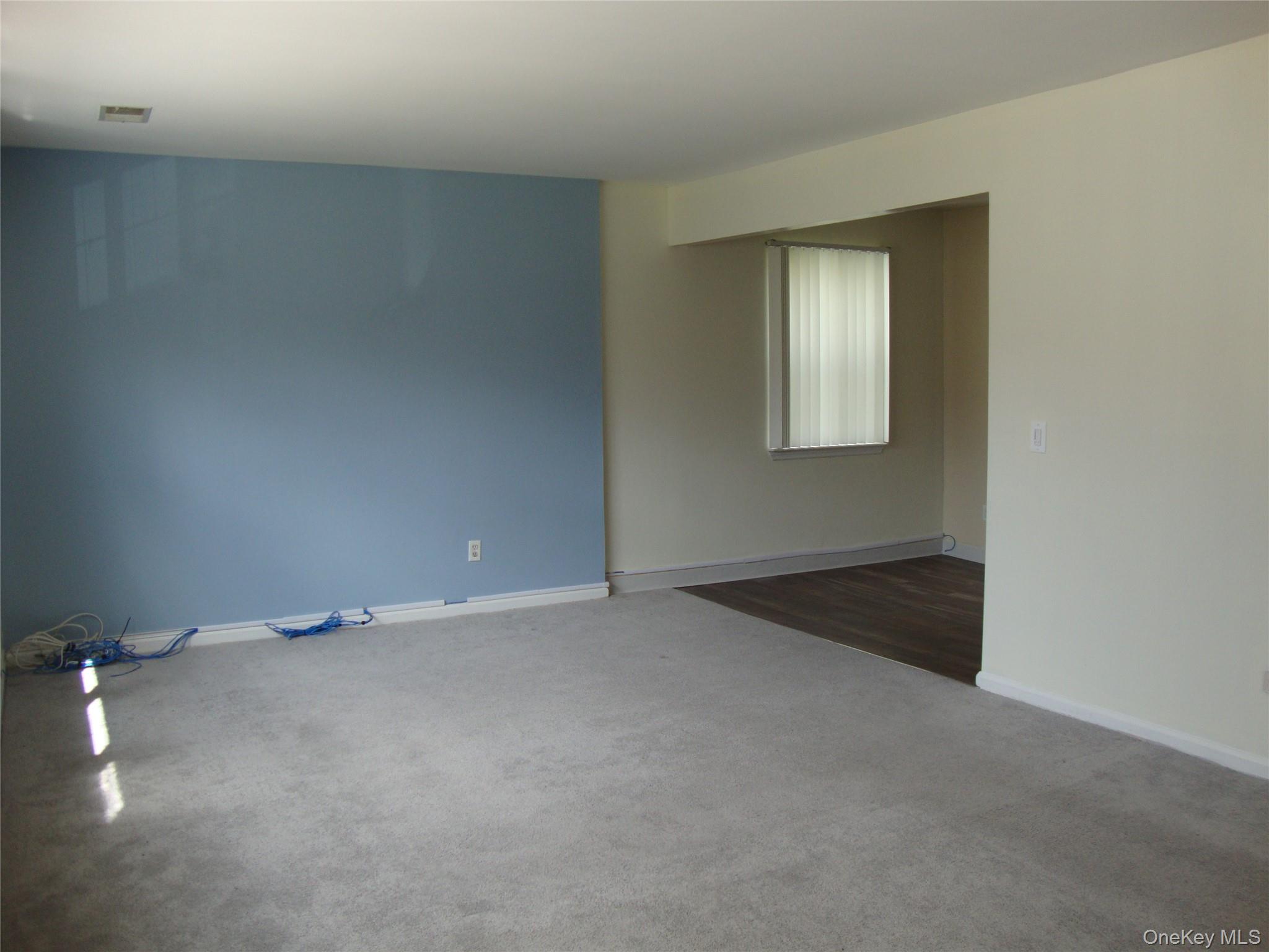 276 Temple Hill Road, Unit 2215 New Windsor, NY 12553 - Photo 5 of 16 an empty room with windows