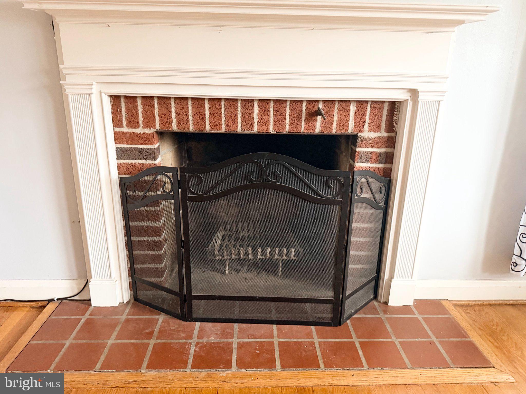 1615 Burnwood Road Baltimore, MD 21239 - Photo 9 of 83 Charming brick fireplace centerpiece.