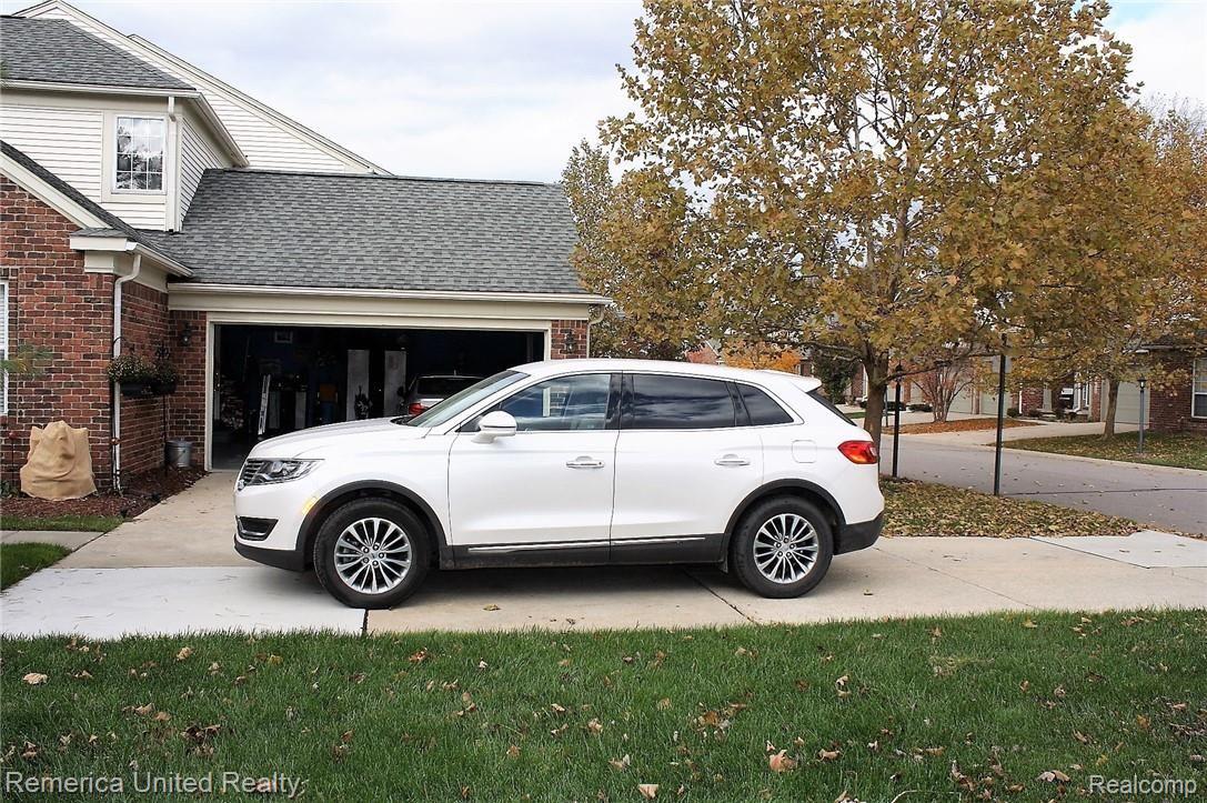 49068 Hawksburry Road, Unit 111 Canton, MI 48188 - Photo 24 of 45 DRIVEWAY.JPG