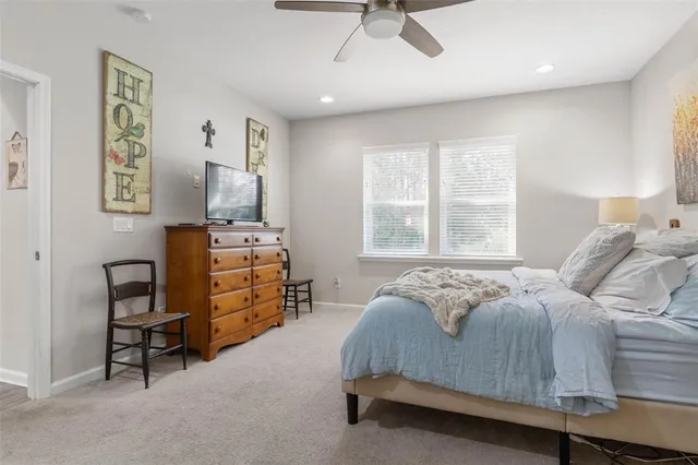 a bedroom with furniture and a window