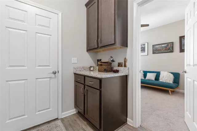 a hallway with cabinets