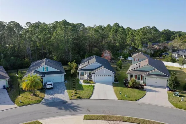 an aerial view of a house with a ocean view