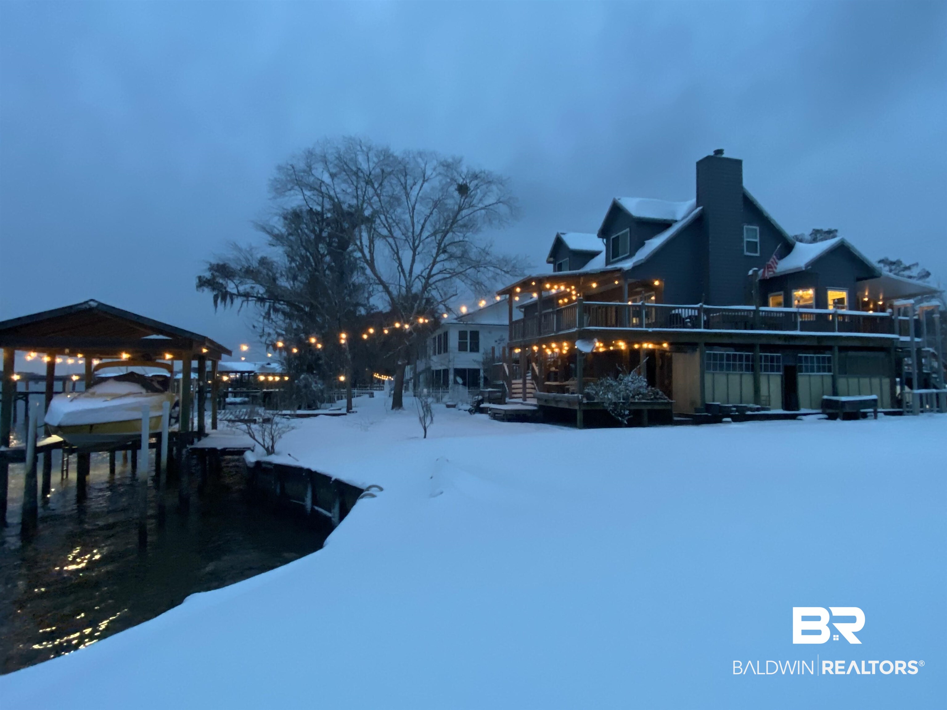 41997 Bayou Road Bay Minette, AL 36507 - Photo 65 of 68 Yard layered in snow featuring boat lift, a boat dock, and a wooden deck