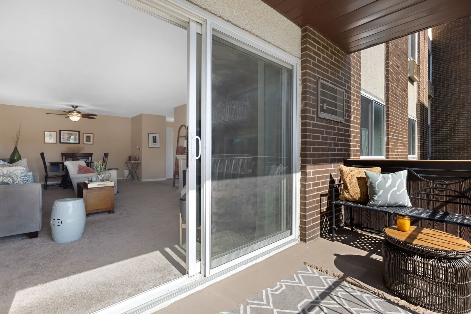 1311 South Finley Road, Unit 205 Lombard, IL 60148 - Photo 17 of 26 a living room with patio furniture and a window