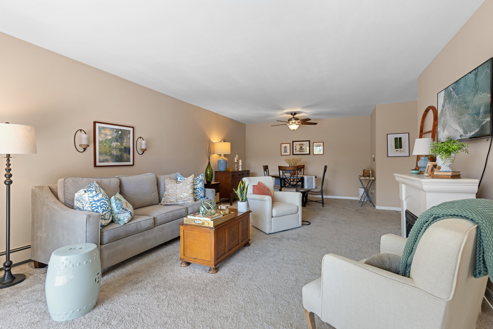 1311 South Finley Road, Unit 205 Lombard, IL 60148 - Photo 3 of 26 a living room with furniture and a flat screen tv