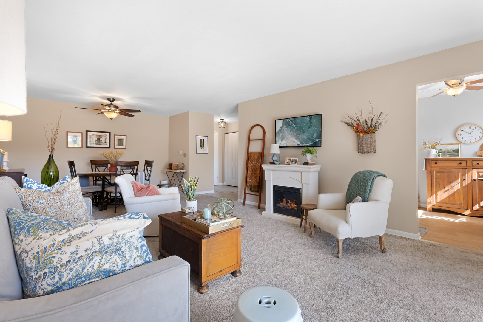 1311 South Finley Road, Unit 205 Lombard, IL 60148 - Photo 5 of 26 a living room with furniture and a fireplace