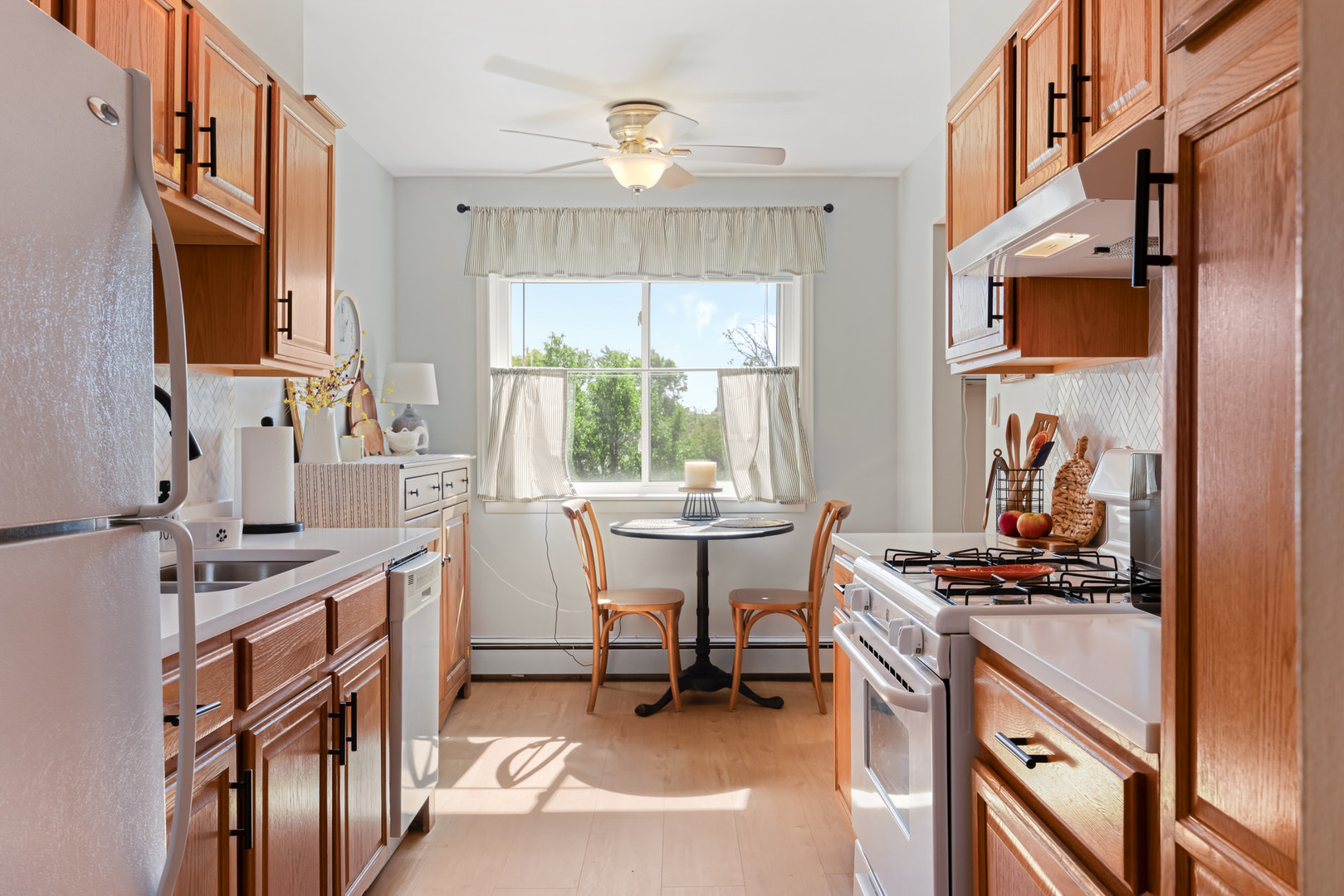 1311 South Finley Road, Unit 205 Lombard, IL 60148 - Photo 7 of 26 a kitchen that has a lot of cabinets in it and stainless steel appliances