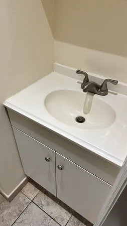 a bathroom with a sink and mirror