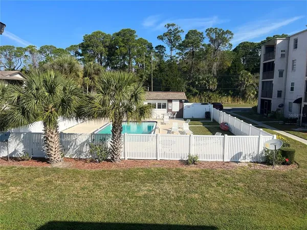 a view of balcony with furniture