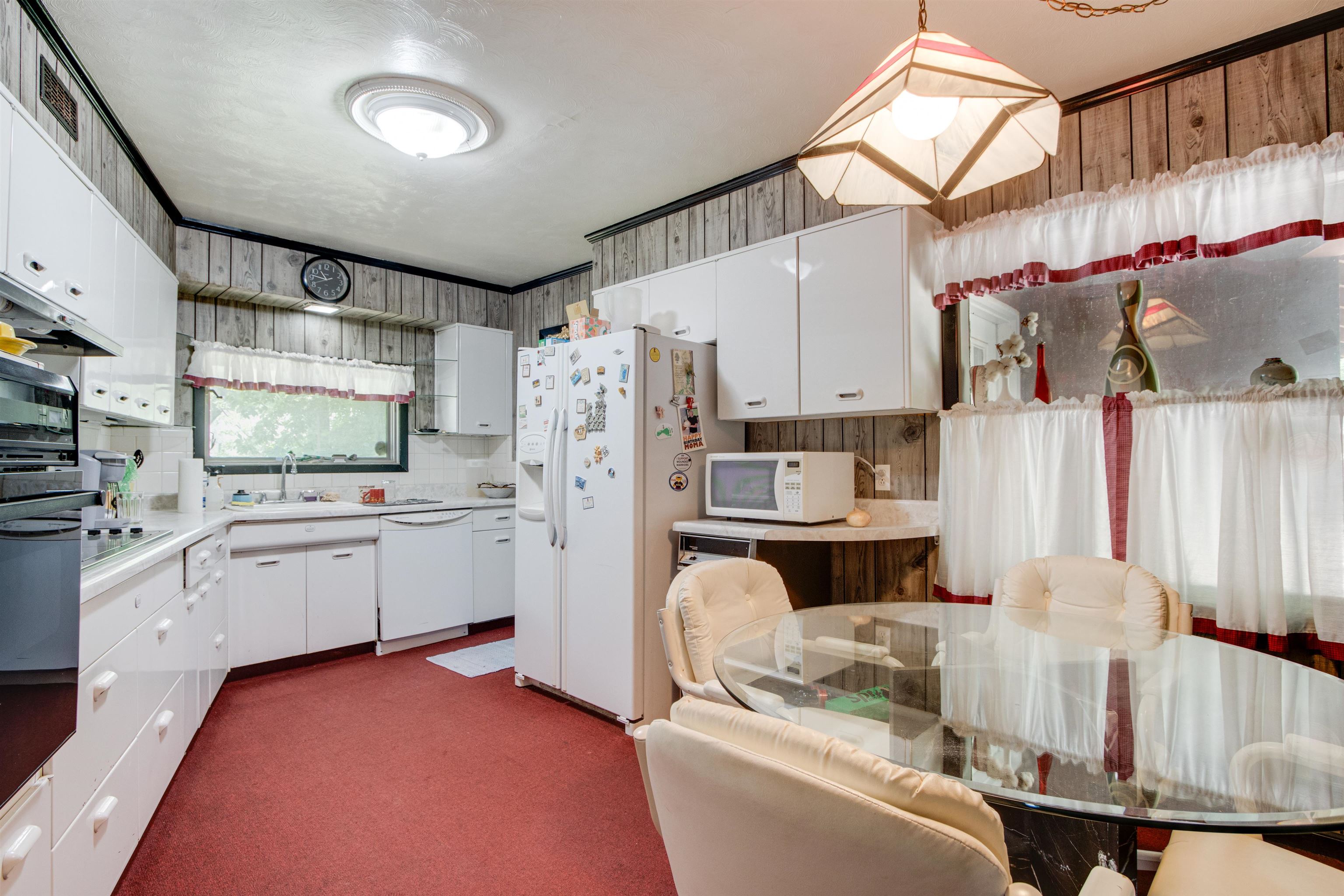 4920 Coro Road Memphis, TN 38109 - Photo 13 of 25 a kitchen with white cabinets and refrigerator