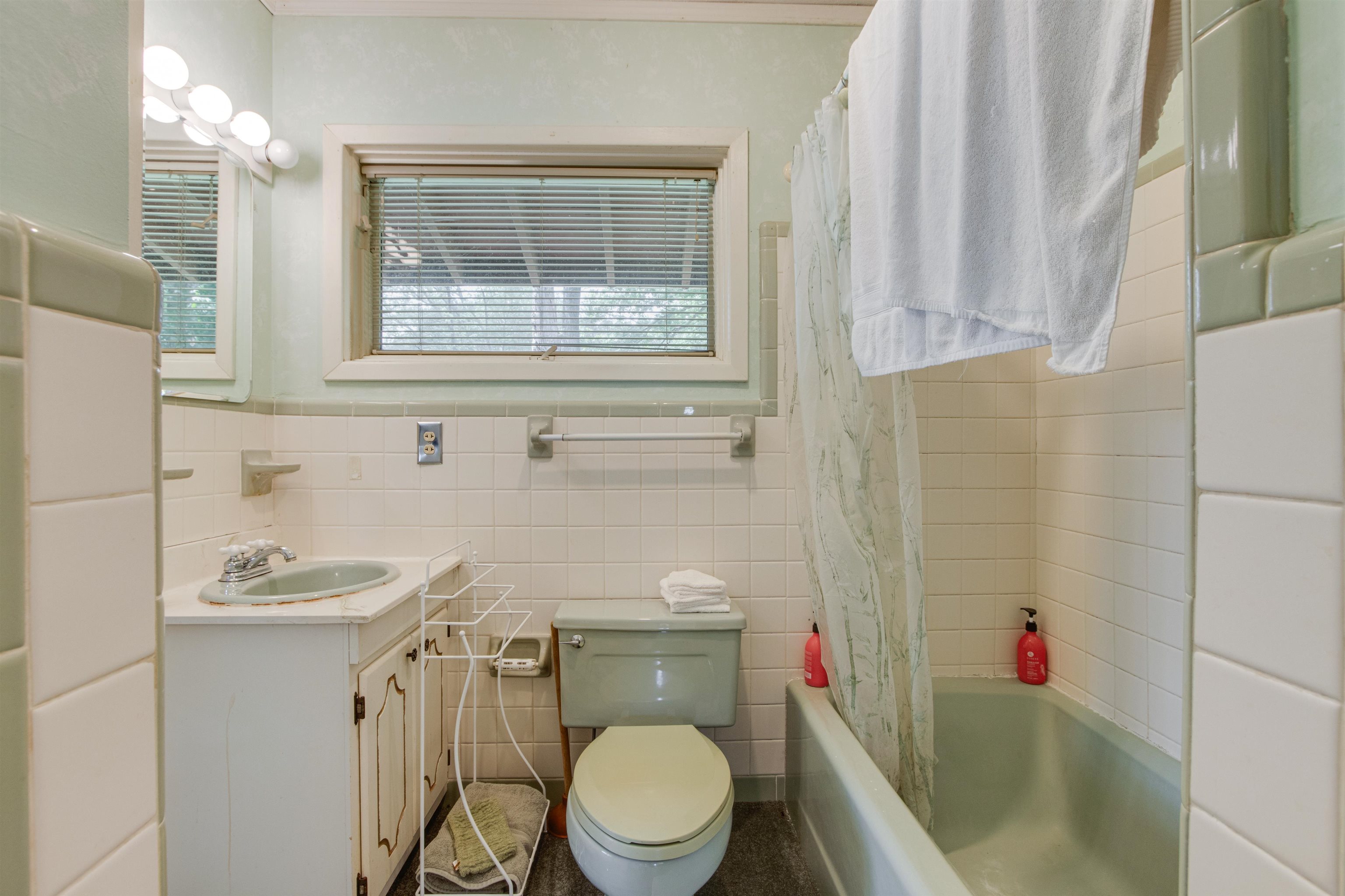 4920 Coro Road Memphis, TN 38109 - Photo 20 of 25 a bathroom with a toilet and a sink