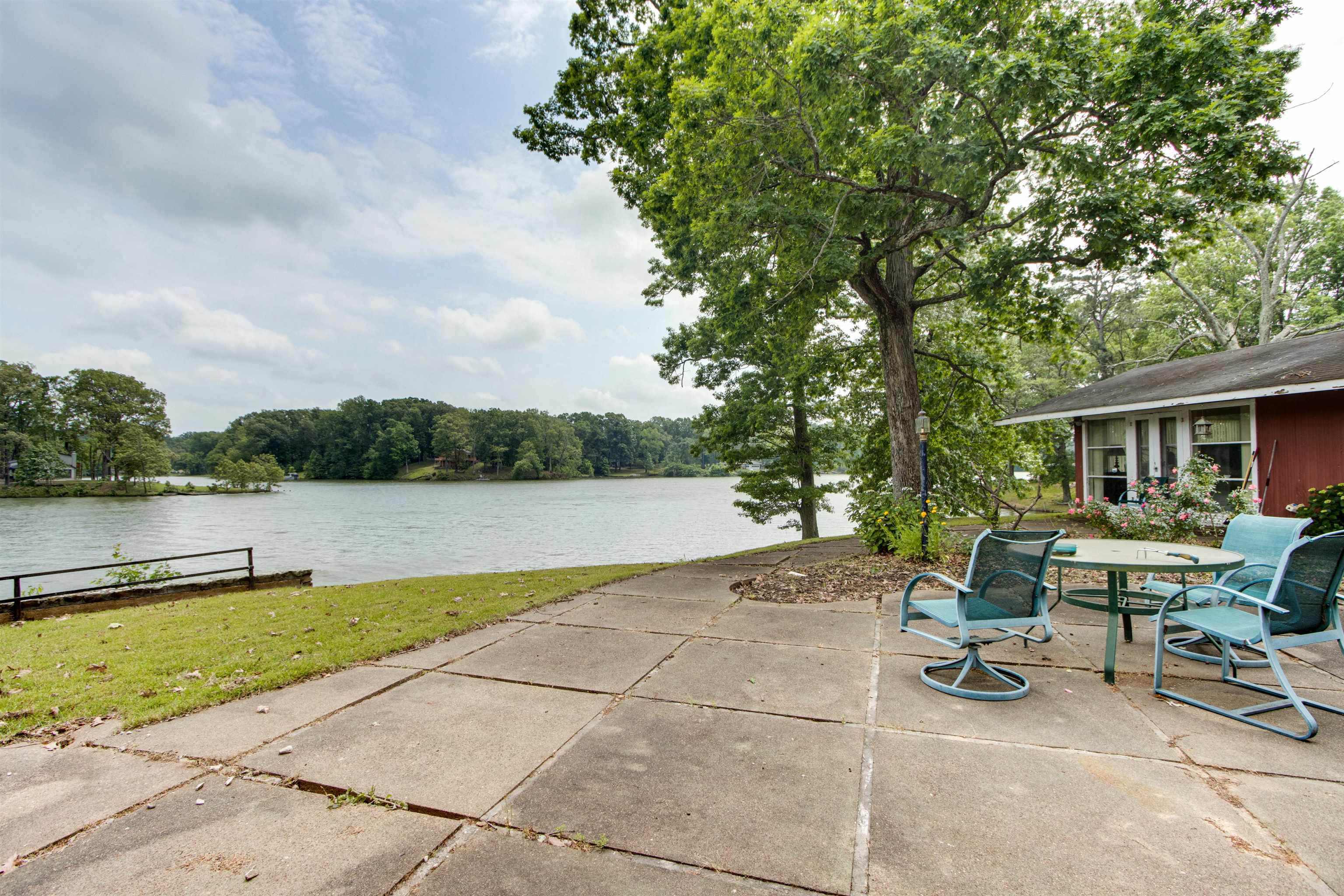 4920 Coro Road Memphis, TN 38109 - Photo 3 of 25 a view of backyard with seating area and lake view