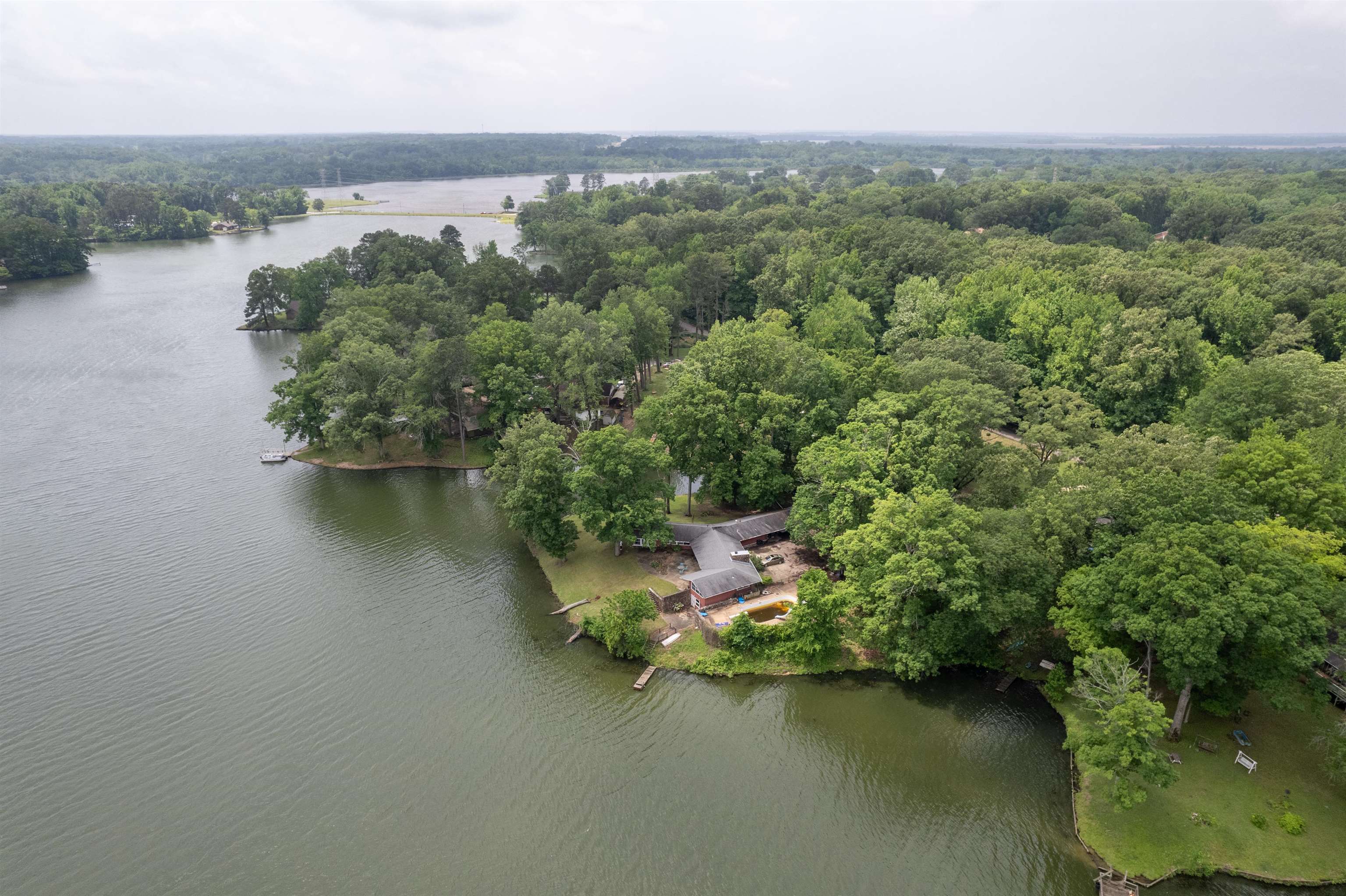 4920 Coro Road Memphis, TN 38109 - Photo 4 of 25 an aerial view of a house with a yard and lake view