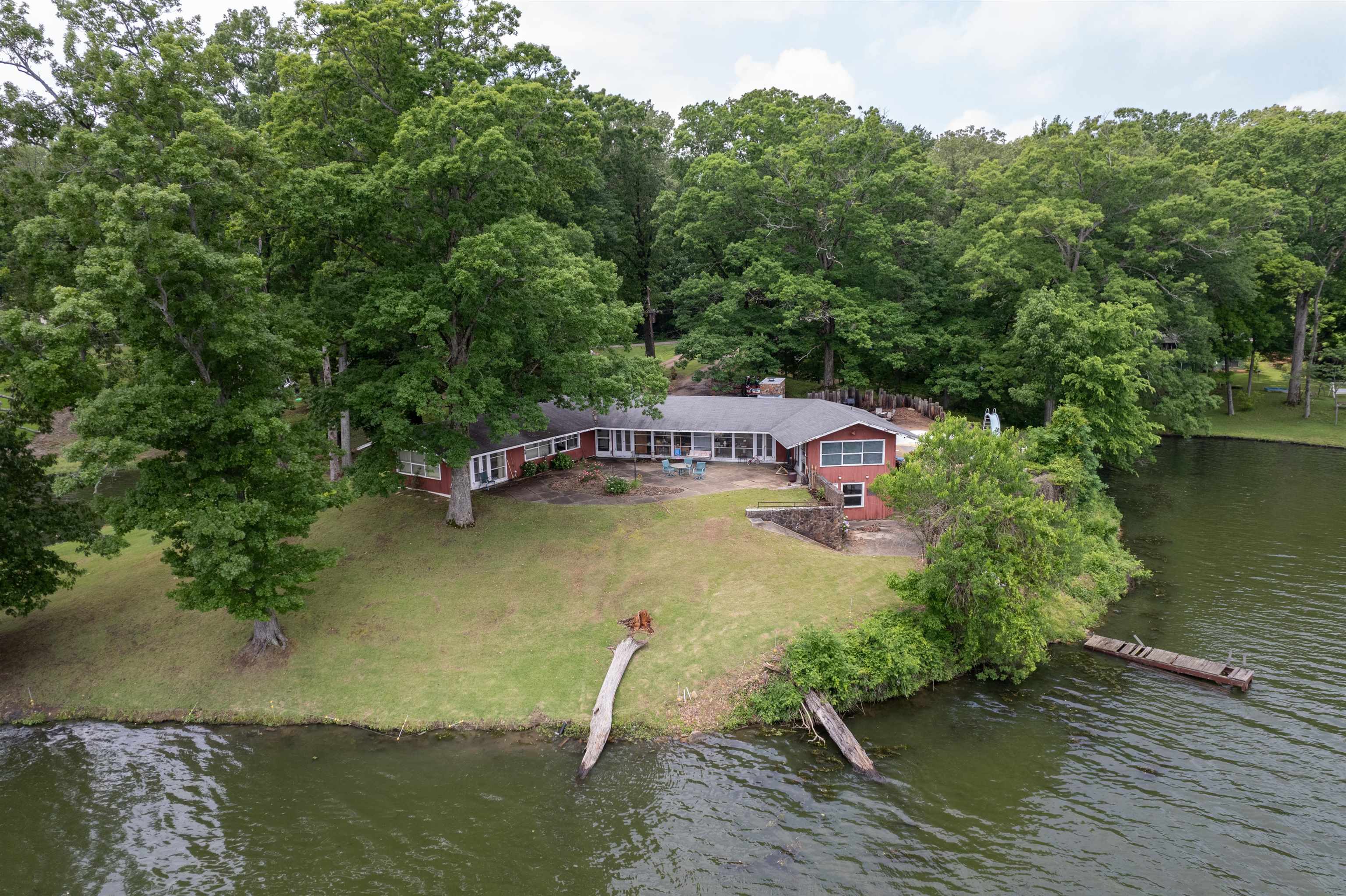 4920 Coro Road Memphis, TN 38109 - Photo 6 of 25 a swimming pool with trees in the background